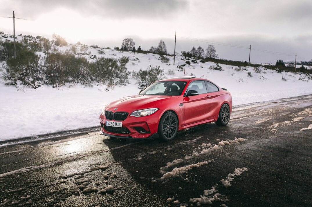 luxury sports car driving on mountain road