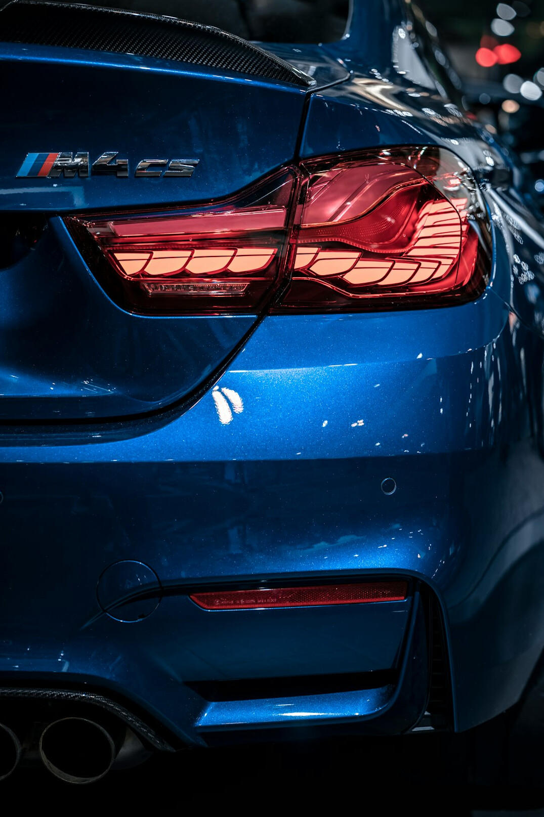Close-up detail of a supercar's rear design and taillight
